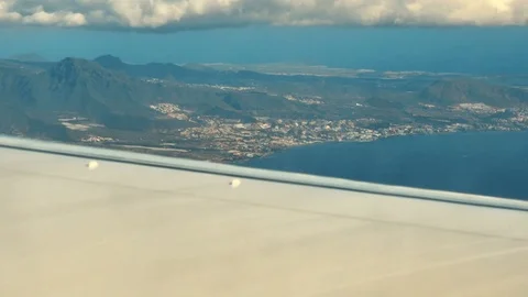 Traveling by air. Panoramic view through an airplane window Stock Footage 71465180
