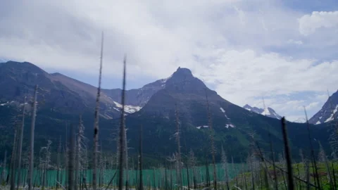 Traveling along pristine terrain, while exploring glacial-carved mountain peaks Stock Footage 204771653