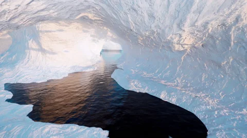 Traveling deep inside a snow-covered ice cave to its large open center. Stock Footage 172487300