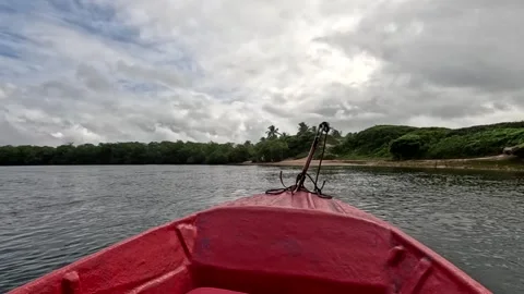 Traveling down the Jequia River in a small red boat Video stock 313157287
