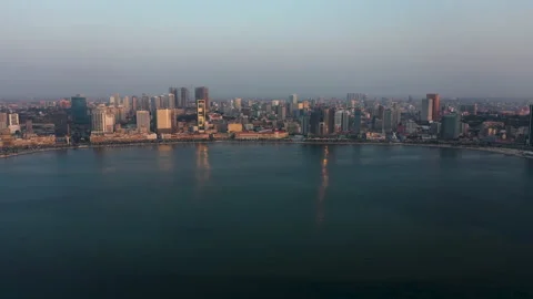 Traveling front up, sky line Luanda city, golden hour flying over Luanda Video stock 157478218