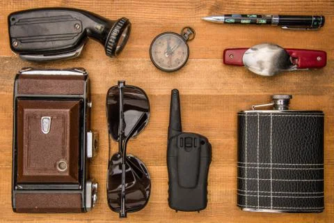 Traveling objects: compass, camera, fan, darkened glasses, walkie-talkie, fla Stock Photos