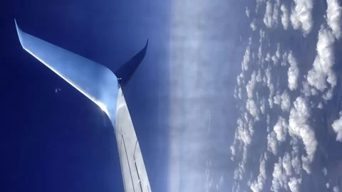 Traveling by plane in the clouds, view from the airplane window Stock Footage 254510032