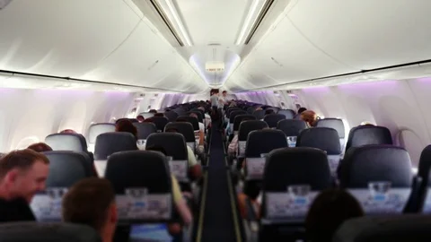 Traveling by plane. Plane interior during filght with unrecognized passangers Stock Footage 73797355