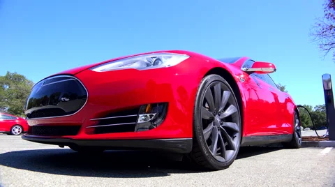 Traveling shot around the front of a Tesla electric car. Stock Footage