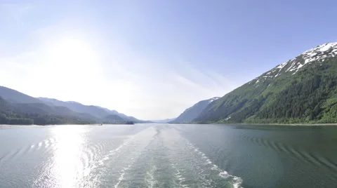 Traveling time lapse view of the Inside Passage from behind a cruise ship in Stock Footage 52215265
