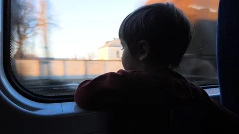 Traveling by train. Boy at train. Cute 5 years old boy looking through the Stock Footage 104268214