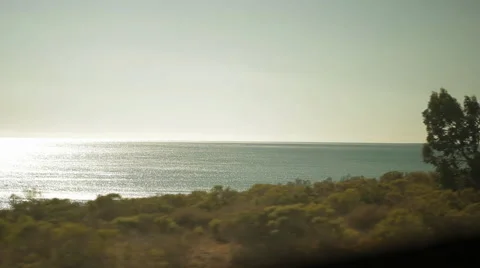 Traveling on train, looking out window viewing land and sea-01 Stock Footage 43736756
