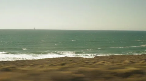 Traveling on a train, looking out window viewing beach &amp; waves-30 Stock Footage 44879119