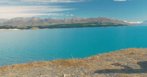 Traveller camping drinks tea in New Zealand by Mount Cook Stock Footage 79995119