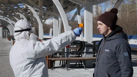 Traveller comes to checkpoint for temperature screening. Coronavirus protection. Stock-Footage 127246882