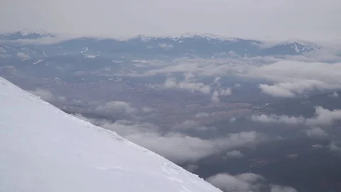 Traveller in the mountains in winter Stock Footage 128195634