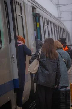 Travellers, back view, boarding a train Stock Photos