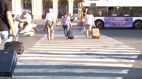 Travellers crossing street. Stock Footage