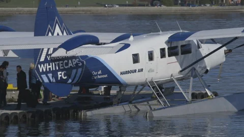 Travellers Loading into Seaplane Stock Footage 147703747