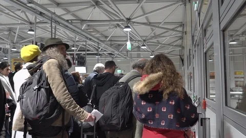 Travellers queue at airport Stock Footage 120111250