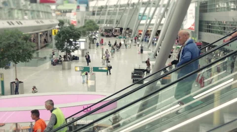 Travellers using escalator at the airport Stock Footage 40832204