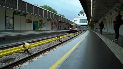 Travellers wait at subway stop outside Stock Footage 122173368
