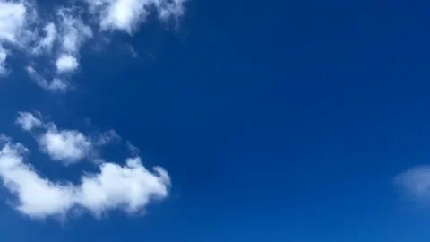 Travelling clouds in blue sky Stock Footage 131369507