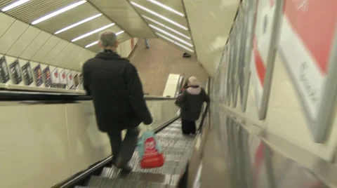 Travelling down escalator to underground station Stock Footage 1086252