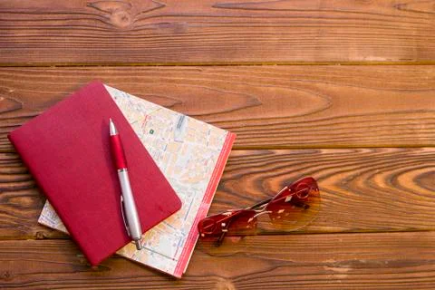 Travelling items on a rustic wooden background Stock Photos