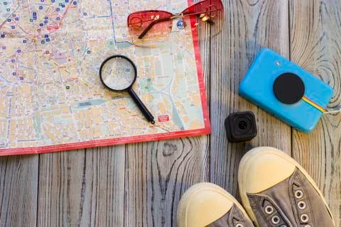 Travelling items on a wooden background Stock Photos