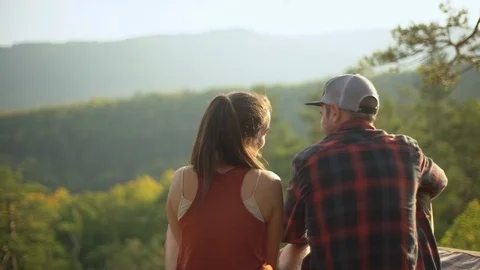Travelling, lifestyle, tourism concept. Slow-motion romantic happy couple hiking Stock Footage