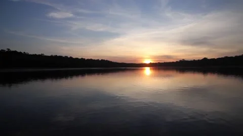 Travelling over amazon rivers sundown Stock Footage 201100823