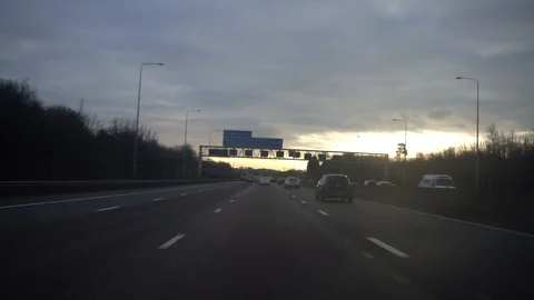Travelling south on the m25 as variable speed limit signs show national 70mph Stock Footage 86769879