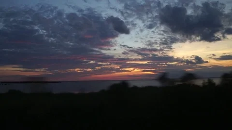 Travelling Sunset in car while driving along Southern Water Front 動画素材 85058599