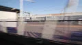 Travelling by train in the UK. Passing train yard. HD Footage