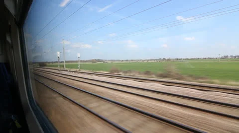 Travelling by train in the UK. Sunny spring day. Stock Footage