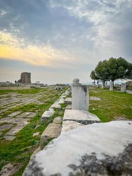 Traverse the Marble Columns of Eumenes II amidst Pergamon Acropolis Sunset Gl Stock Photos