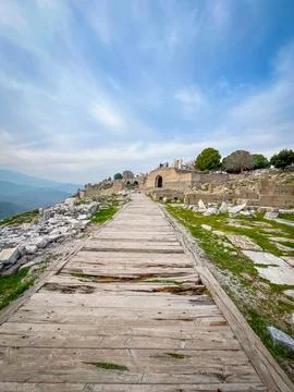Traversing the Ancient Pathway of Attalid Pergamon Acropolis amidst Cloud-V.. Stock Photos