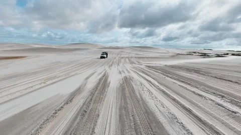 Traversing Broad Wet Sand Tracks in Lençóis Maranhenses Video stock 342441857
