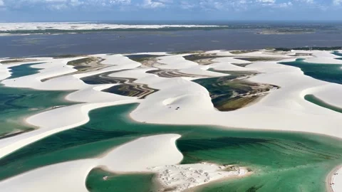 Traversing Curving Lagoon Channels and White Dunes at Lençóis Maranhenses Stock Footage 342444377