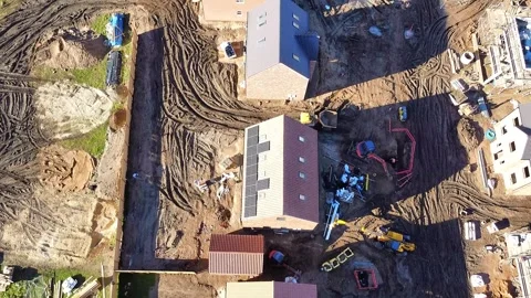 Traversing down the rooftops of new houses being built Stock Footage 339614973