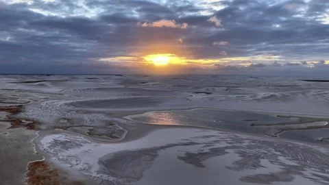 Traversing Reflective Sand Channels at Sunset in Lençóis Maranhenses Stock Footage 342442878
