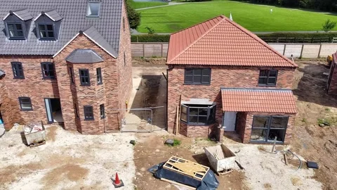 Traversing right to left on a house building site Stock Footage 339614865