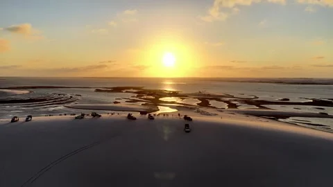 Traversing Sunset Reflections and Shallow Water Channels in Lençóis Maranhenses Stock Footage 342444939