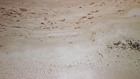 Travertine marble in a close-up shot treated with clear resin Video stock 251829798