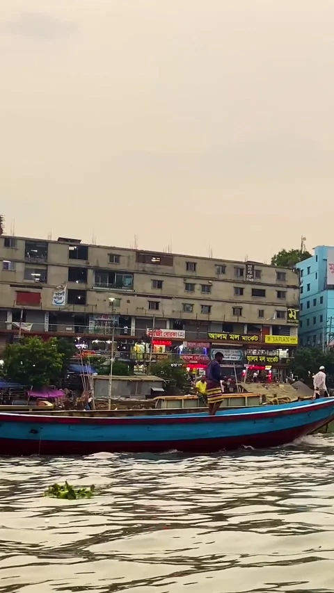 Trawler and cargo ship crossing buriganga river at sadarghat in keraniganj Stock Footage 333006547