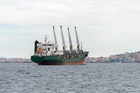 Trawler with cranes on deck at sea Stock Photos