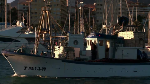 Trawler exits port to fish Stock Footage 30676929