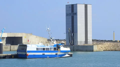 Trawlers and ice machine tower of the port of La Cotiniere in Saint-Pierre Stock Footage 276645154