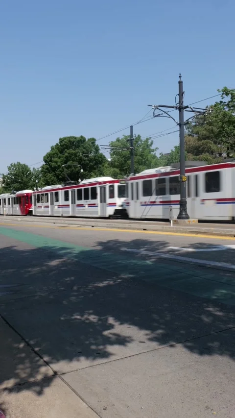 TRAX light rail Siemens SD-100 SD-160 cars passing on Temple street Stock Footage 304508296