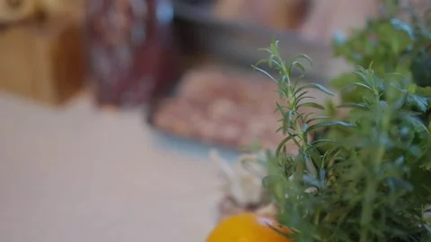 A tray of bacon sits on a counter next to a box of onions Stock Footage 295367103