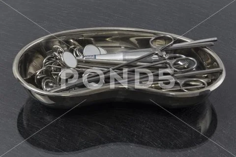 Tray with dentist equipment on gray table Stock Photos