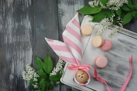 On the tray is an Easter egg decorated with a napkin Stock Photos
