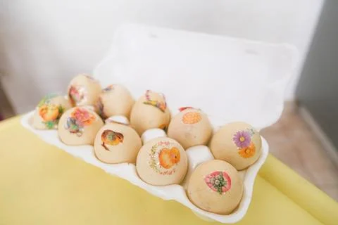 A tray of eggs with various designs on them Foto stock